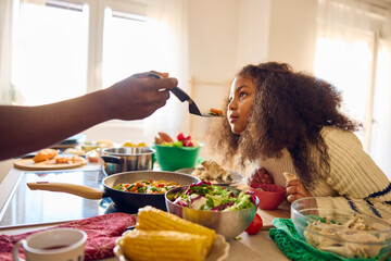 Parent offers the child to taste the food
