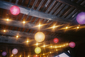 Lanterns and String Lights Under Wooden Canopy, Outdoor Venue
