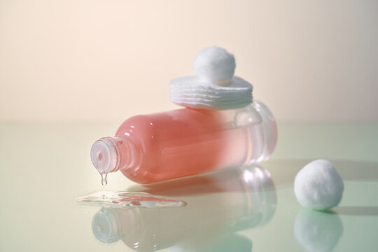 Skincare product with cotton pads and a cotton ball
