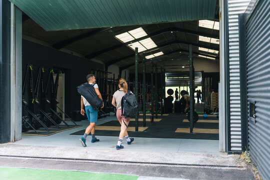 Couple entering gym for functional training workout