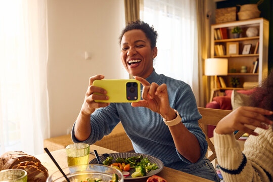 Woman captures moments at lunch