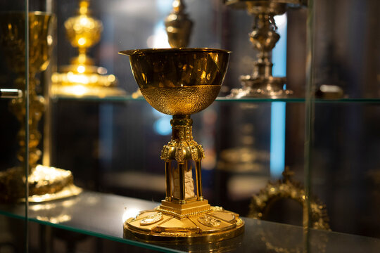 Golden chalice displayed in a glass case.. Orense Cathedral, Spain