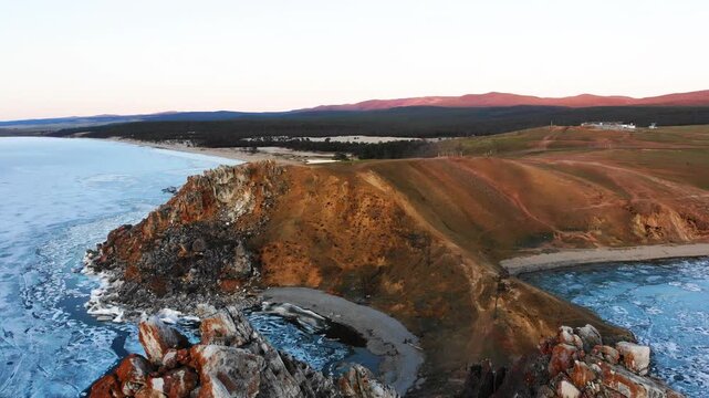 Cape Burkhan on Olkhon Island. Lake Baikal in the spring. Ice melting time on the lake.