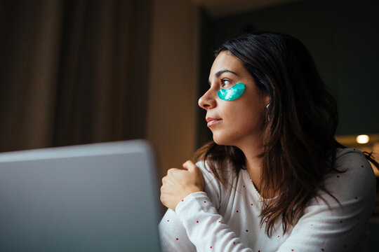 Woman Working From Home With Eye Patches