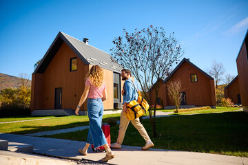 Couple headed towards their vacation rental