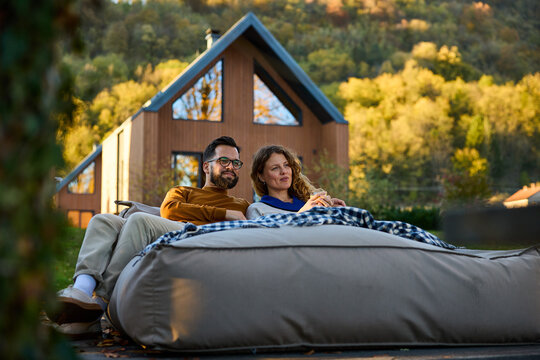 Happy couple is resting outside