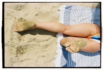 A woman hides in the shade from the scorching sun