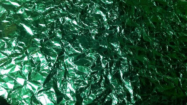 Abstract Emerald Green Metallic Foil Texture with High Contrast Reflections