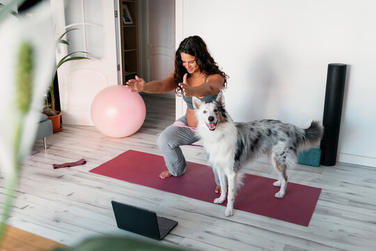 Pregnant woman doing exercise at home