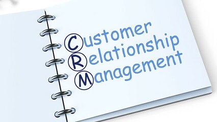 Customer relationship management concept written on a spiral notebook page