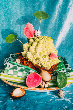 Fruit and decorative items on a colorful surface