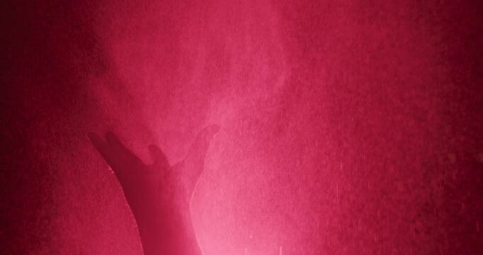 zombie hand reaches upward in slow motion