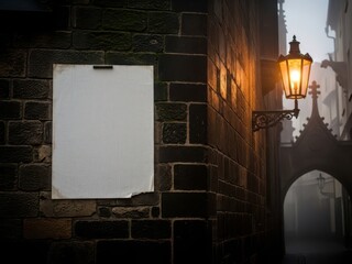 Blank poster on an old brick wall illuminated by a vintage street lamp in a misty alleyway