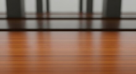 A close-up view of a polished wooden floor with blurred background