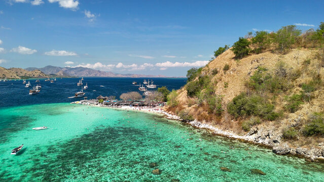 Beautiful panoramic drone view over Pulau Kelor Komodo showing crystal clear tropical ocean