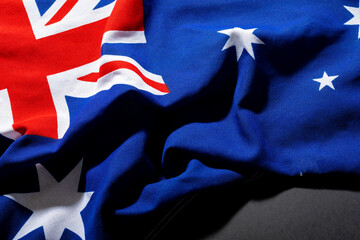 Overhead view of australia flag with stars and british union jack over table