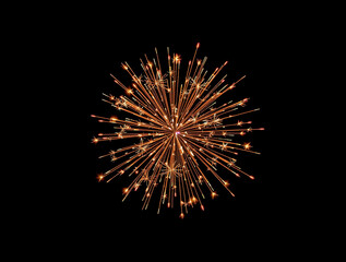 Single bright orange firework bursting against a black background with radiating sparks