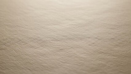 Soft beige textured background surface.
