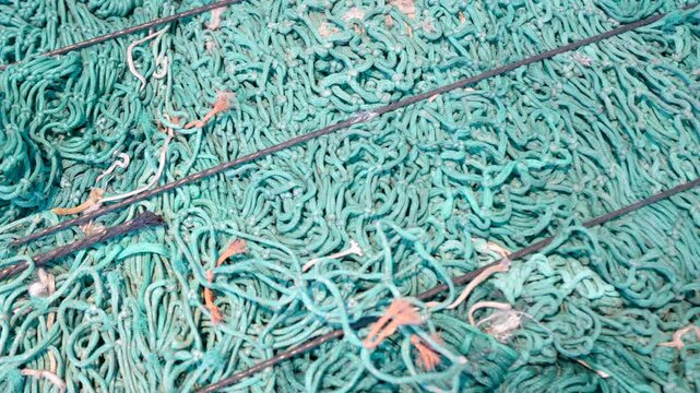Old fihings nets collected from the ocean. Ghost fishing net.