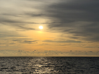 Cloudy evening over open sea horizon