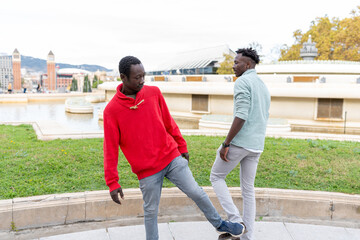 African men enjoying friendship at Pla&ccedil;a d'Espanya in Barcelona city