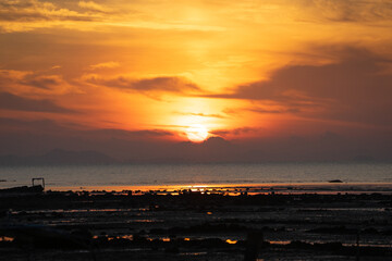 The sunrise above the horizontal line of the sea