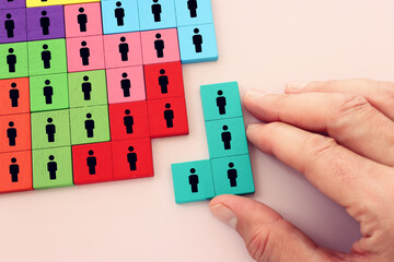 Business image of puzzle with people icons over pastel background, human resources and management concept