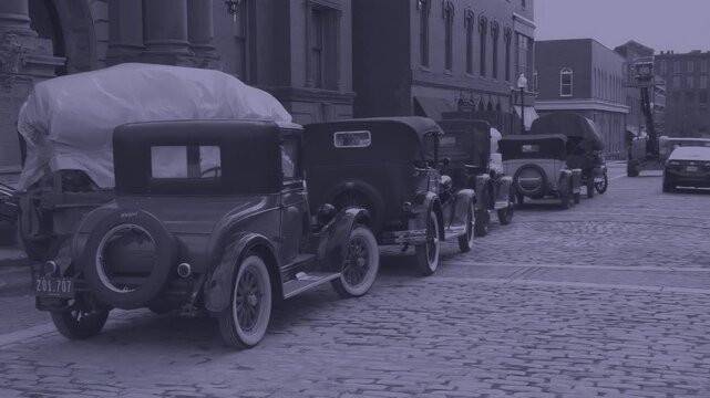 Moody film noir shot of 1920s picture cars staged for production. Features historically accurate ghost prop plates and period-accurate styling. Creative cinematic grade applied for mystery