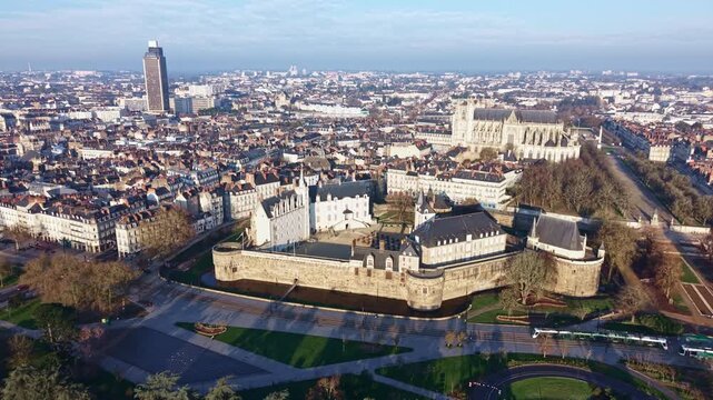 Castle of the Dukes of Brittany with local tramway, Brittany Tower and Place Mar&eacute;chal-Foch with Cathedral of St Peter and St Paul in the background from above, Nantes, Loire-Atlantique, France