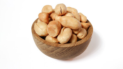 Fototapeta premium Roasted peanuts isolated on a white background, top view. Pile of shelled peanuts with a few scattered nuts on white background.