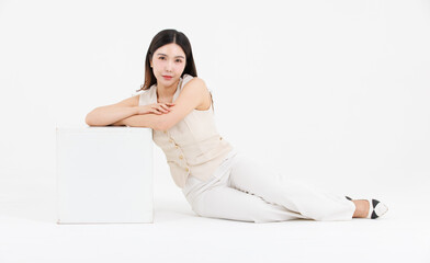Portrait of attractive asian professional cheerful beautiful woman in work shirt style long black hair smile sitting posing lay down on floor confident positive on isolate white background studio.