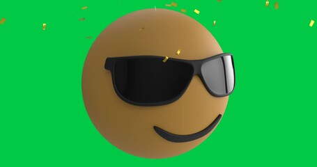 Confetti falling over face wearing sunglasses emoji against copy space on green background