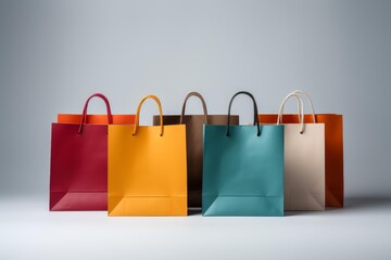 Various empty paper bags standing in a row, representing consumerism and gifts