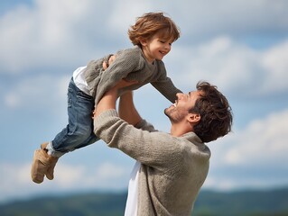 father playing with son in the park. happy family kid dream concept. father throws baby up in summer . parent and child play toss up silhouette outdoors in the park lifestyle