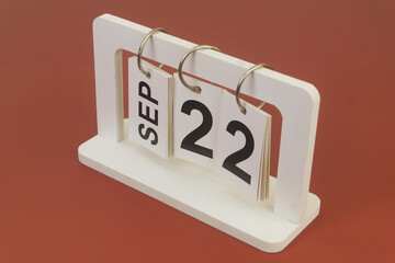 September 22 on calendar on brown background