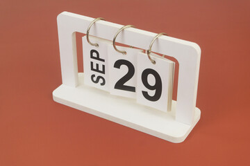 September 29 on calendar on brown background