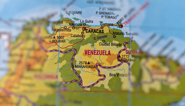 Close-up of a map of Venezuela and a map of Colombia showing the country borders. Selective focus