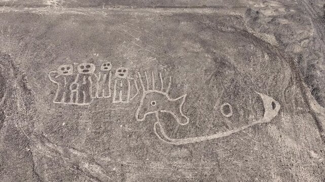 Aerial- Nasca lines (owl, fish, bee) in the desert of Peru