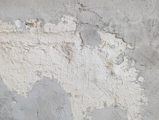 White and grey damaged grunge wall texture. Old paint and cement abstract background.