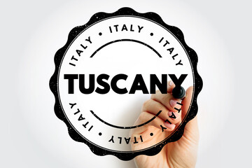TUSCANY stamp with bold lettering inside circular seal, hand holding marker emphasizing Italian origin, regional identity concept for certification, authenticity, provenance, quality assurance