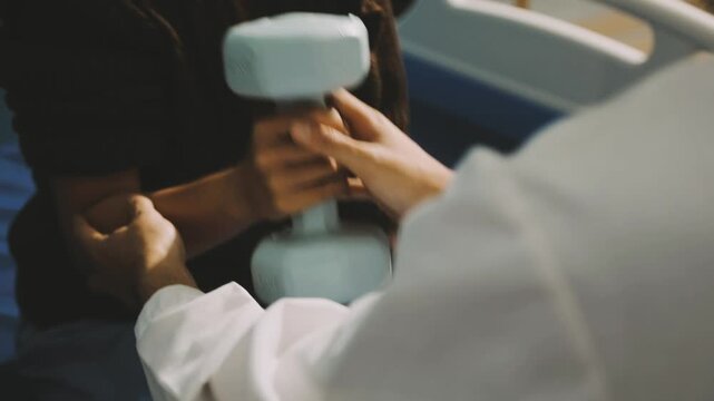 Physical therapist doctor teach senior man patient using dumbbell exercise for chest and arms muscle at Physiotherapy clinic. Medical wellness healthcare and physical rehabilitation in elderly people.