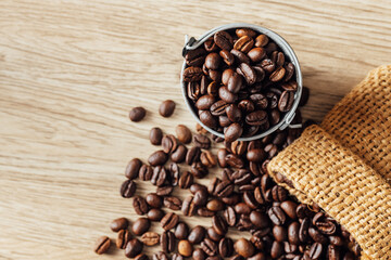 Freshly Roasted Coffee Beans in Metal Bucket on Wooden Surface