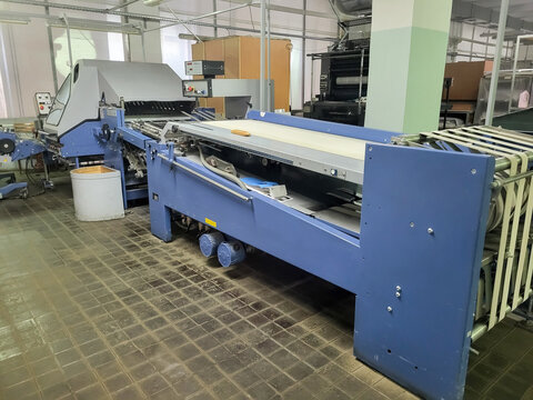 Professional industrial paper folding machine in printshop