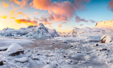 Astonishing Flakstadpollen and Boosen fjords with cracks on ice during sunrise