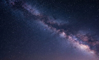 Fototapeta premium stunning milky way galaxy across the night sky, dense stars, soft cosmic glow