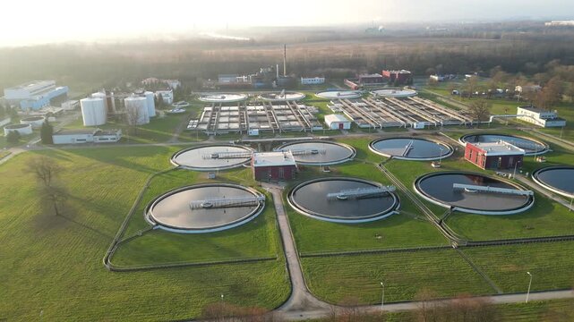 Aerial view showcasing expansive water treatment facilities in a large city, highlighting intricate sewerage systems. Complexity of urban infrastructure. Modern industrial plant of big city. Ecology
