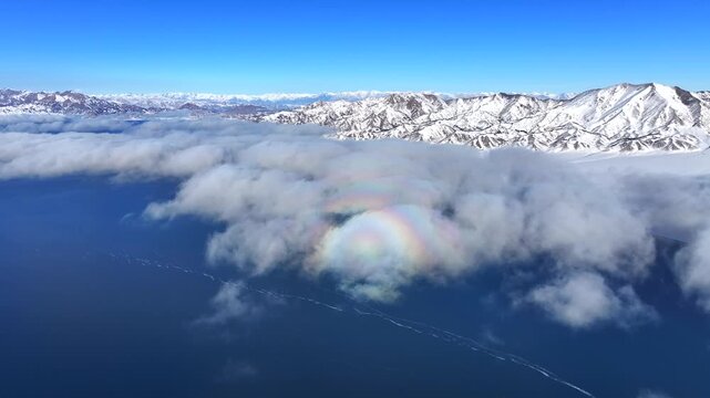 Aerial Winter Mountain Landscape with Clouds and Lake Sayram