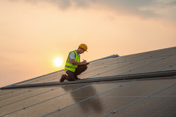 man in  yellow vest is working on  solar panel