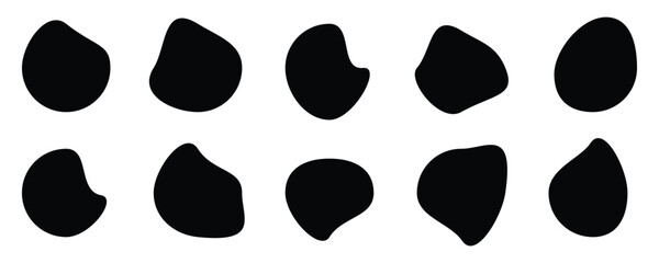 Fototapeta premium Abstract black irregular blob shapes set. Organic random liquid forms in flat style. Organic blob shape isolated on white background. An arrangement of black organic shapes.