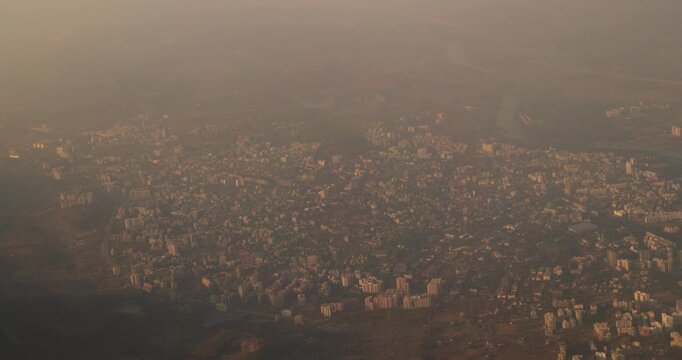 Ulhas river, Mumbai, India. Badlapur is a city in Thane district, Maharashtra state, India, and is a part of Mumbai Metropolitan Region. Aerial View From Airplane Window On View of the Mumbai suburb